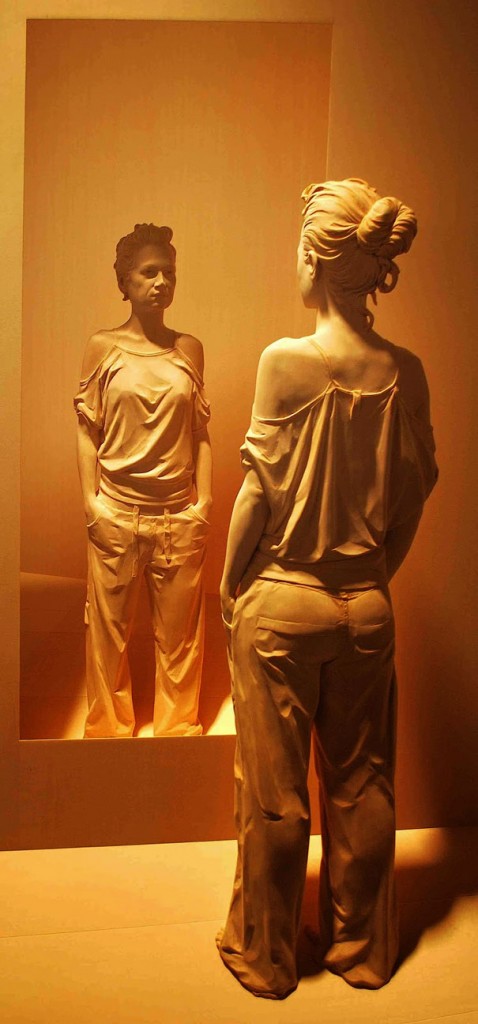 Even the Wrinkles on her Shirt Look Real as she Studies Herself in the Mirror